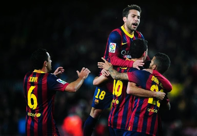 Sergio Busquets celebrating with Barca players