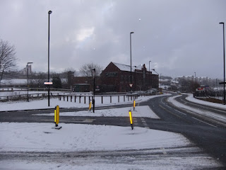 A snowy City Road looking east towards The Hotel du Vin.