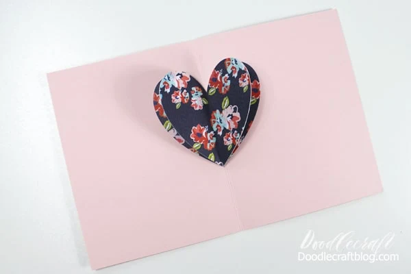Make a simple pop up card with 3 hearts, folded cardstock and Tombow Adhesive