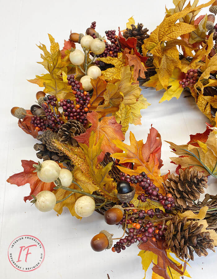 Easy no brainer DIY Fall wreath made with recycled garlands and seasonal picks from old wreaths you've grown tired of. A budget fall decorating idea.