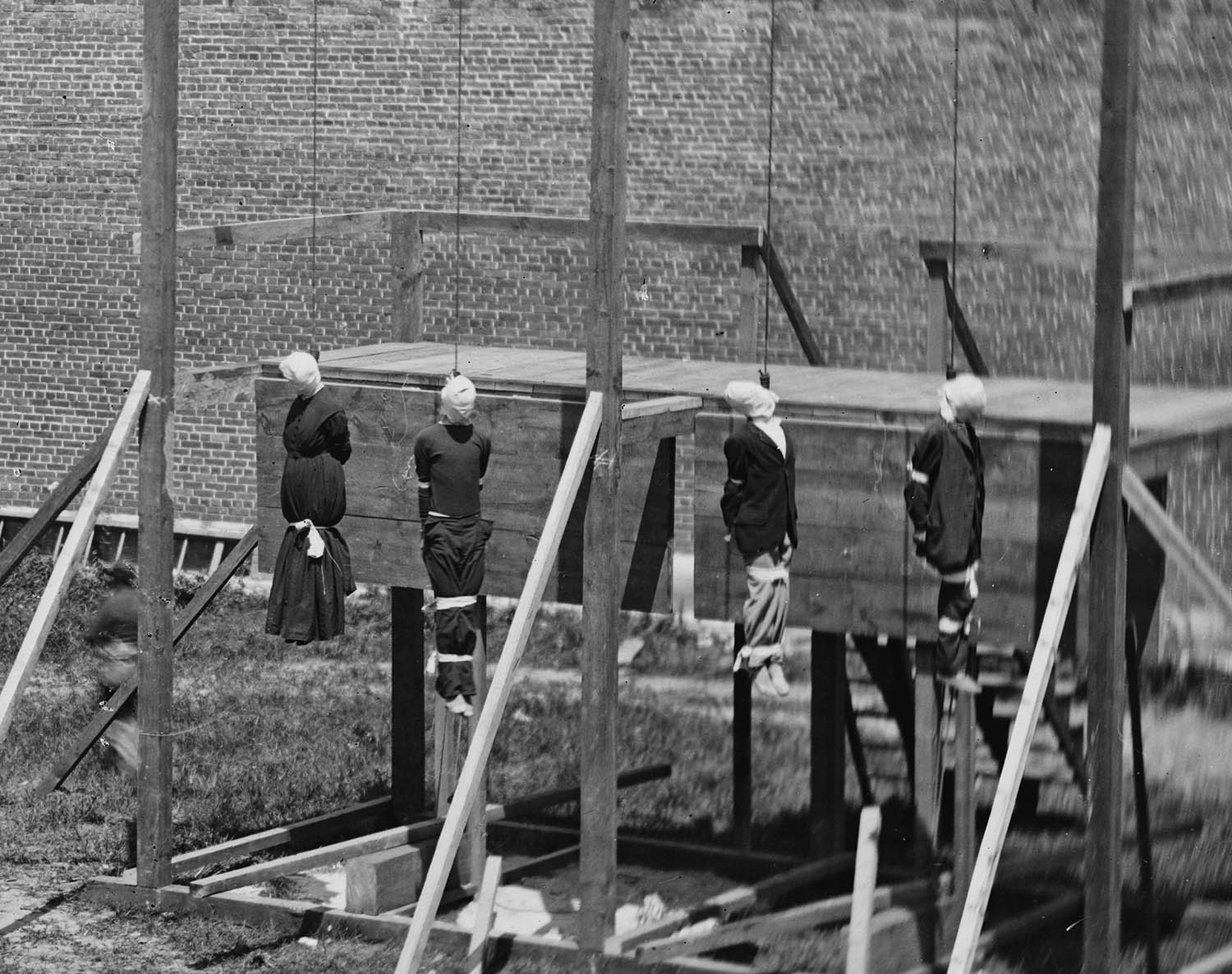 Close-up: The bodies continued to hang and swing for another 25 minutes before they were cut down.