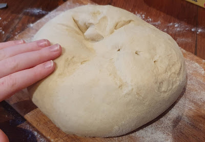 Olive Oil Bread dough recipe - dough being caressed by a small boy's hand