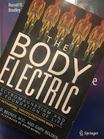 The Body Electric, superimposed on the cover of Intermediate Physics for Medicine and Biology