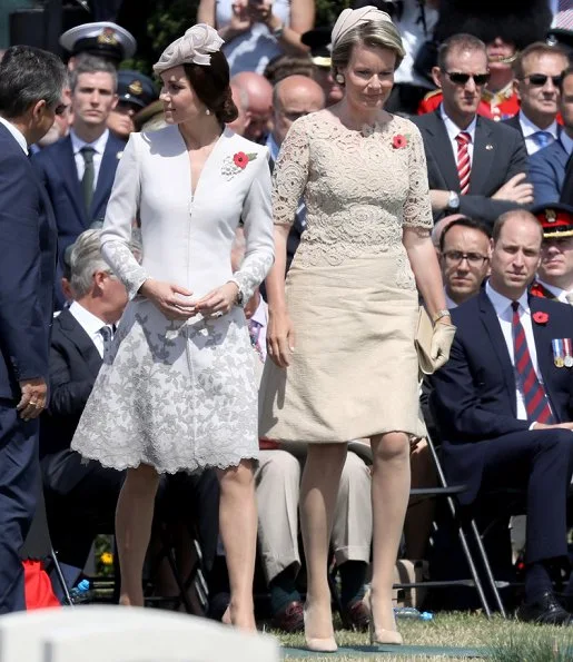 Kate Middleton wore Catherine Walker dress. Queen Mathilde wore Natan Dress. Prince Charles, Prince William and Catherine, Duchess of Cambridge