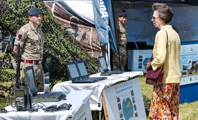 The Princess Royal wore a yellow jacket, blazer and floral print midi skirt or dress. Burgundy leather bag and sunglasses