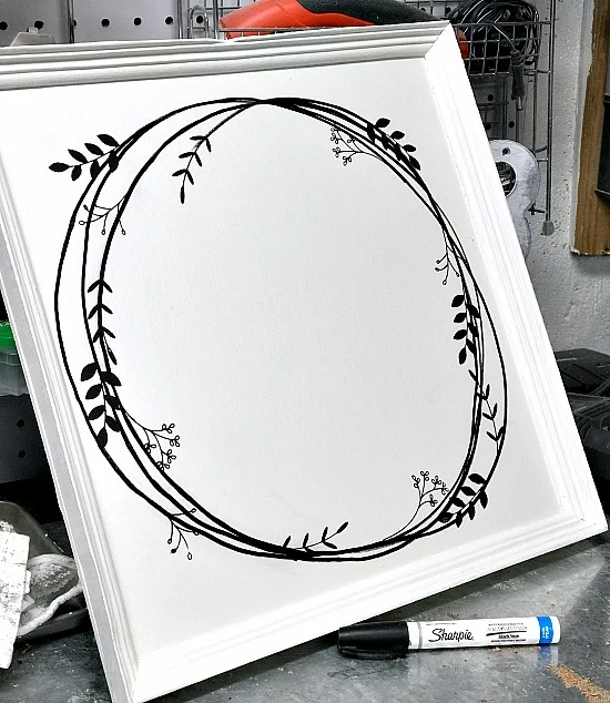 DIY hand drawn wreath with transfer leaves.