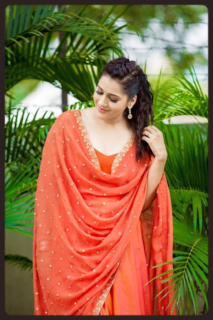 Anchor Rashmi Gautam Hot Photoshoot In Orange Dress