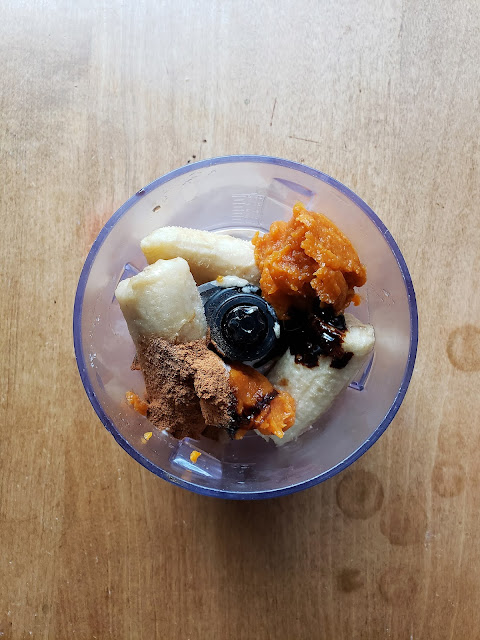 Pumpkin pie banana ice cream ingredients in a blender