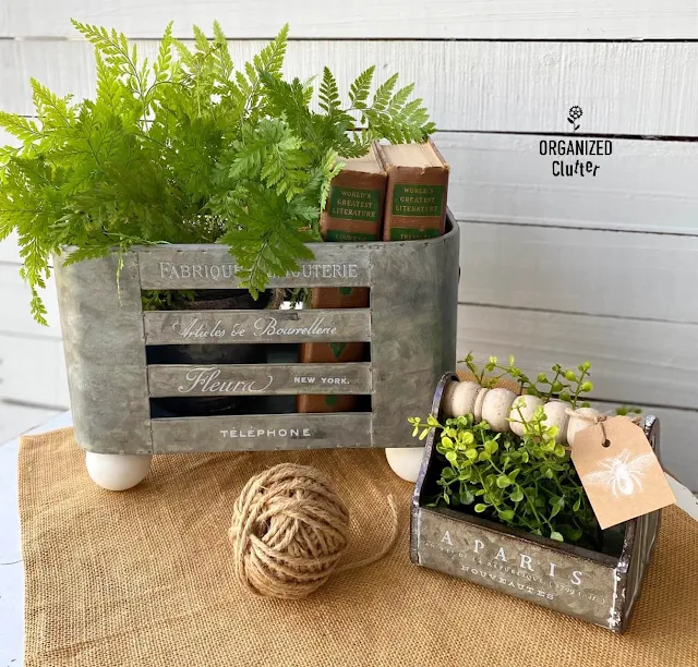 Photo of two upcycled galvanized containers with greenery