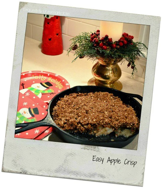 Polaroid photo of apple crisp on table with holiday decor