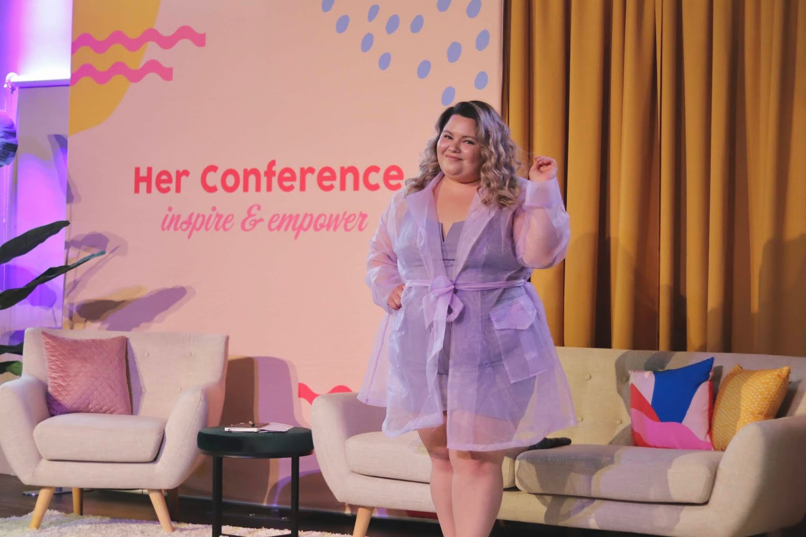 Chicago Plus Size Petite Fashion Blogger, YouTuber, and model Natalie Craig, of Natalie in the City, attends Her Campus' Her Conference and reviews Fashion Nova Curve's see-through mesh lilac lavender jacket.