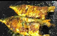 Crisp golden two full fish fry on the pan or tawa