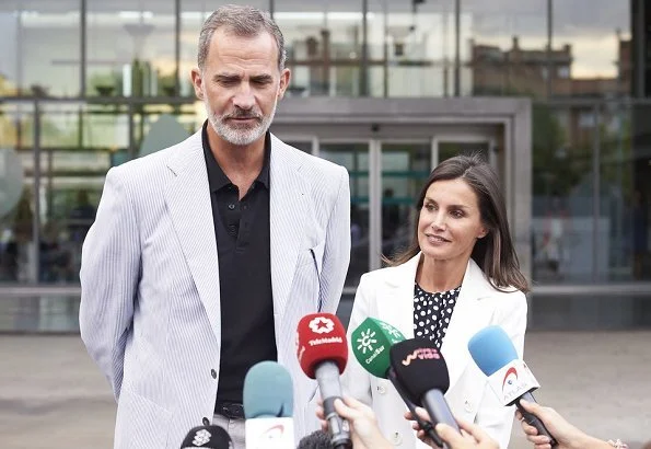 Queen Letizia wore Carolina Herrera navy ecru polka dot silk blouse. Queen Sofía and her sister, Princess Irene of Greece