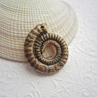 http://www.etsy.com/listing/164080478/handmade-ammonite-pendant-handmade?ref=shop_home_active