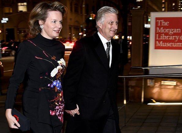 Queen Mathilde wore a floral-print crepe maxi dress by Dries van Noten. King Philippe and Queen Mathilde attended the briefing