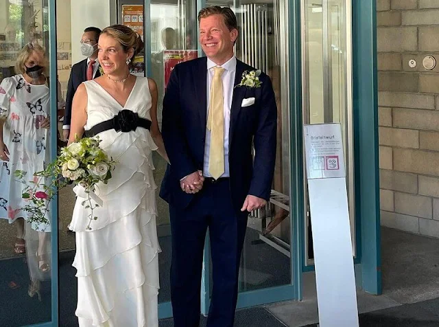 Tessy Antony wore a white ruffled wedding gown with a black belt, she accessorised with a diamond necklace and earrings