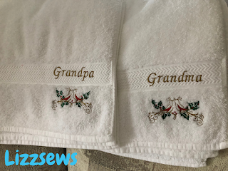 Set of towels that are embroidered and say grandma and grandpa with little bird designs underneath
