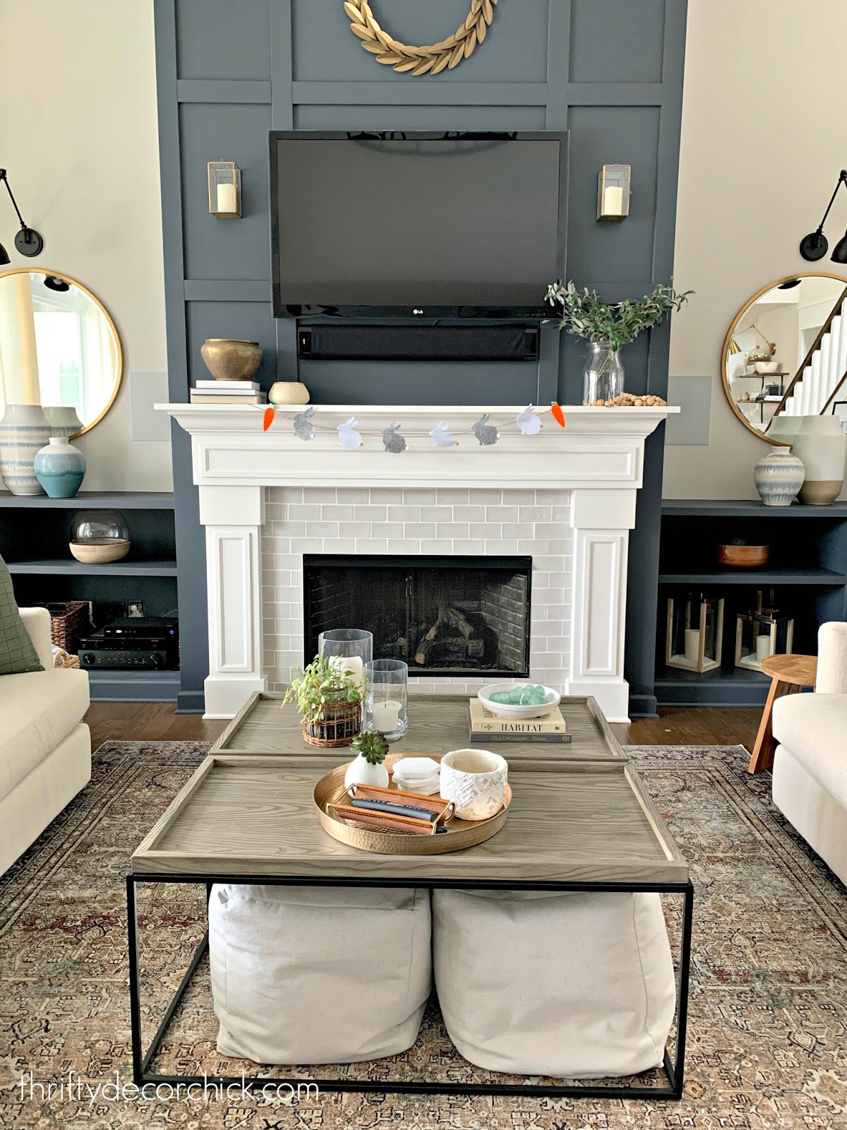 Tall fireplace with dark paint and grid trim work 