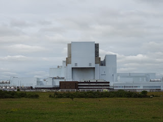 Torness Nuclear Power Station - a picture showing the white structure of the power station and how it almost blends into the clouds above.  Photo by Kevin Nosferatu for the Skulferatu Project