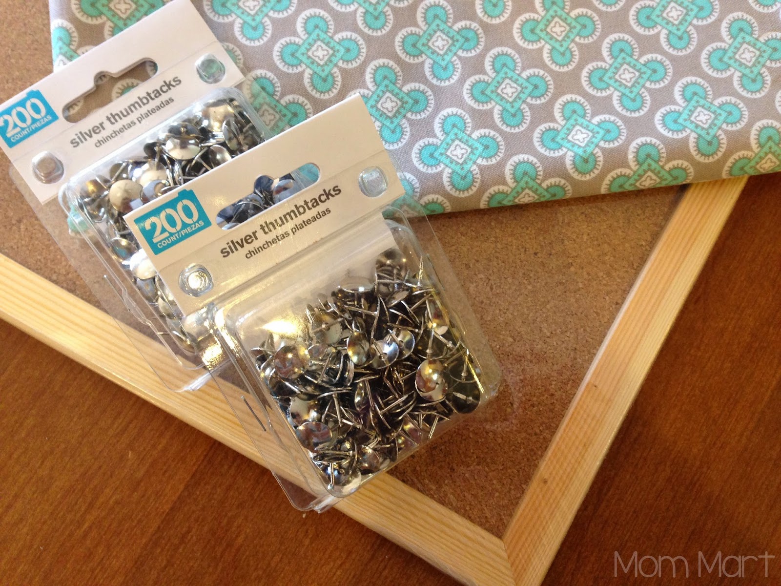 DIY fabric covered cork board with a faux nail head trim #DIY #HomeDecor #WeekendProject