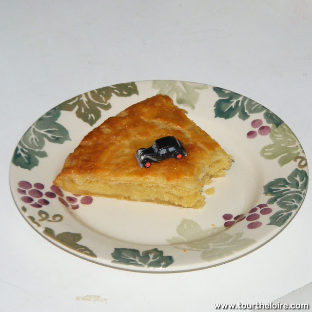 Homemade galette des rois with a classic Citroen Traction Avant feve.  Indre et Loire, France. Photographed by Susan Walter. Tour the Loire Valley with a classic car and a private guide.