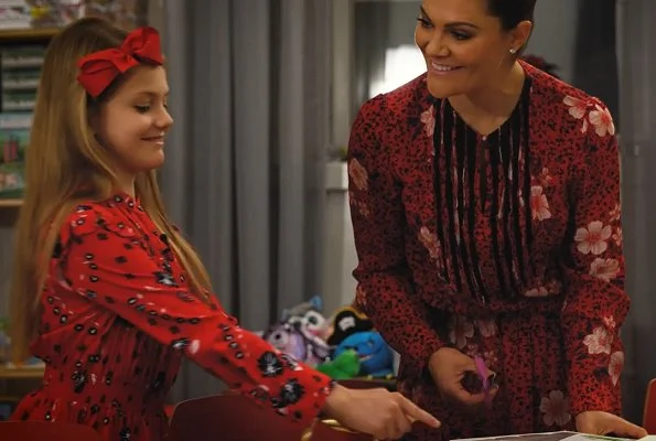 Crown Princess Victoria wore a floral dress from Zadig & Voltaire. Princess Estelle wore a red floral print blouse and asymmetric skirt