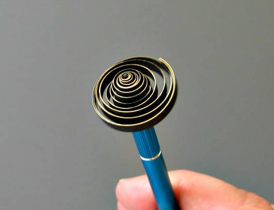 relaxed coil on slotted quilling tool