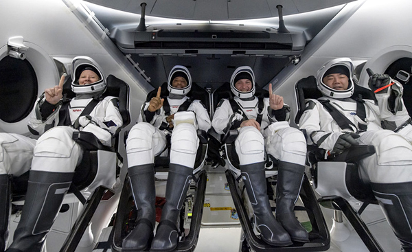 The Crew-1 astronauts take one last group photo aboard Resilience before disembarking from their capsule for the return trip back to Houston, Texas...on May 2, 2011. The Crew-1 astronauts take one last group photo aboard Resilience before disembarking from their capsule for the return trip back to Houston, Texas...on May 2, 2011.