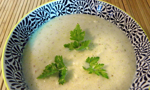 Bowl of Vegan Cream of Celery Soup garnished with Parsley