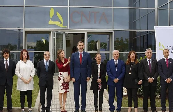 Queen Letizia wore Felipe Varela blouse and floral skirt, Felipe Varela clutch bag, Magrit pumps. National Centre for Technology and Food Safety