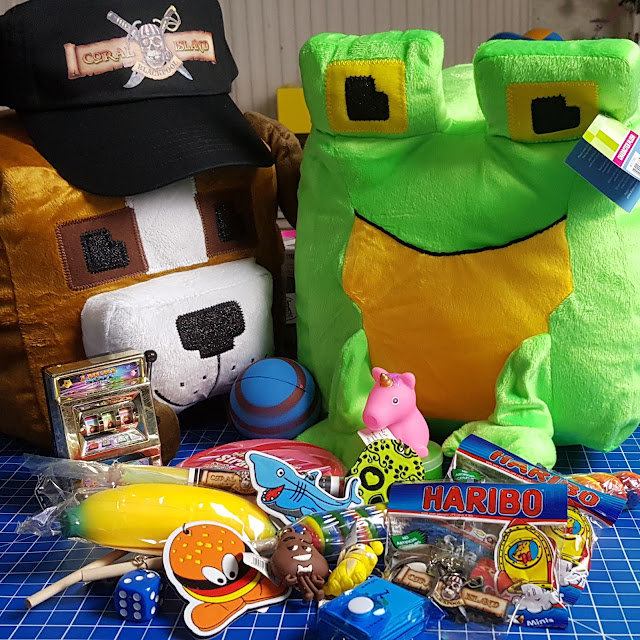 Coral Island prize haul soft toys keyrings rock sweets