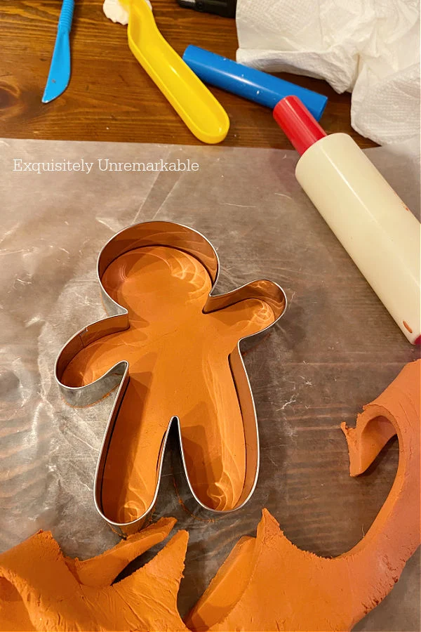 How To Make Clay Ornaments, metal cookie cutter gingerbread man on table