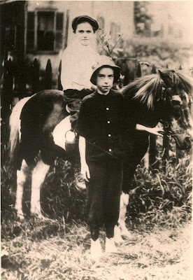 Wallace B. Dixon on a pony, and his pal, Jimmie Fahy, not on the pony. 1912. Wallace B. Dixon on a pony, and his pal, Jimmie Fahy, not on the pony. 1912.