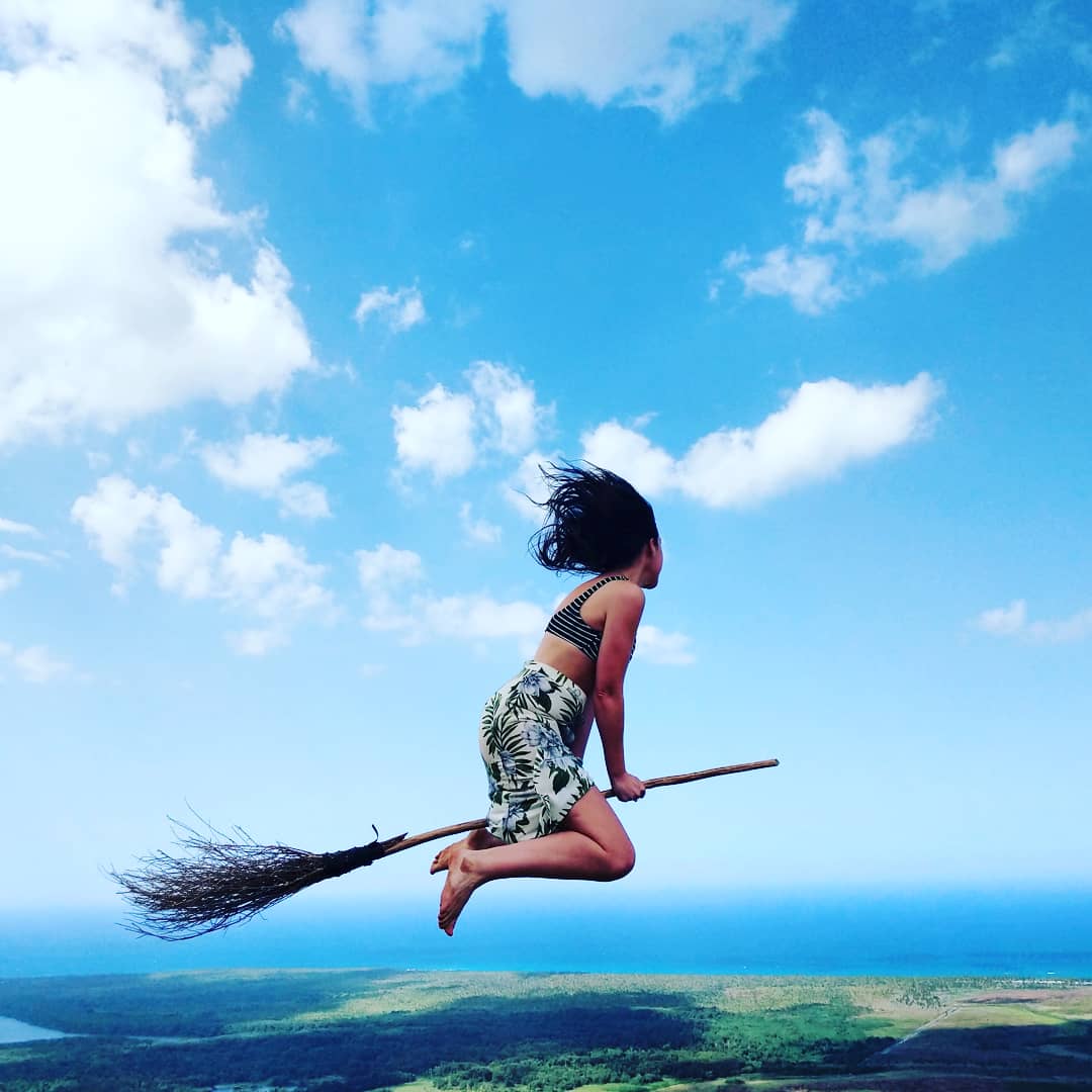 girl on broomstick in mid air amazing views