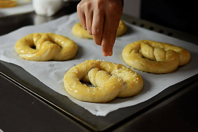 sprinkle sea salt before baking pretzel