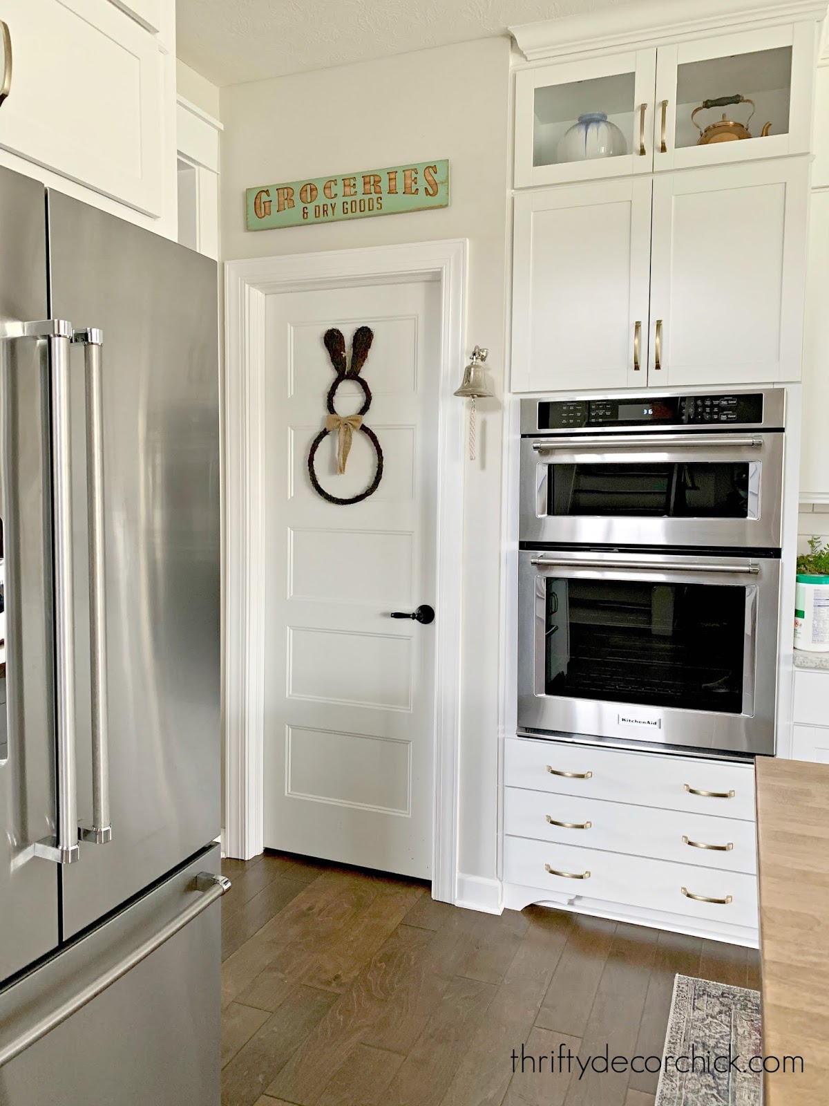 White kitchen dark floors 