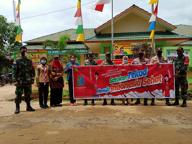 Peringati Hari Kesehatan Nasional Ke-56, Satgas Yonif 642/Kps Bersama Stakeholder Membagikan Masker dan Sosialisasikan Protokol Kesehatan