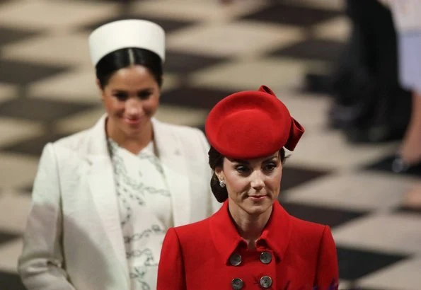 Meghan Markle wore Victoria Beckham printed crepe long sleeve midi dress, Kate Middleton wore a red coat by Catherine Walker