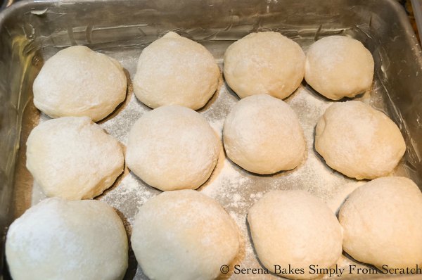 Dust shaped potato roll dough with flour and rise.