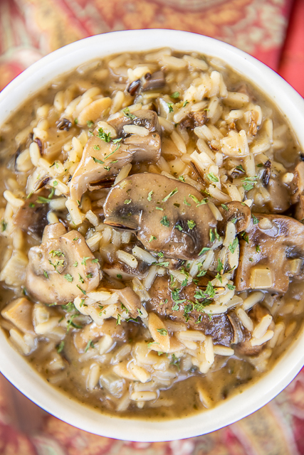 Mushroom & Wild Rice Soup - so simple and ready to eat in 20 minutes. Serve with some crusty bread and dinner is done! Onion, fresh mushrooms, chicken broth, water, sherry, cream of mushroom soup, and a box of quick-cooking long grain and wild rice. We make this at least twice a month. SO easy and delicious! #soup #mushrooms #mushroomsoup #wildrice #quickmeal bowl of mushroom and wild rice soup