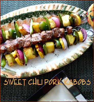 Sweet Chili Pork Kabobs: pork tenderloin, vegetables and pineapple chunks marinated, skewered and grilled. | Recipe developed by www.BakingInATornado.com | #recipe #dinner