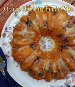 Orange Blueberry Bundt Cake, full of fruit flavor, this cake is studded with blueberries and mandarin oranges, and is drizzled with an orange topping. | Recipe developed by www.BakingInATornado.com | #bake #cake