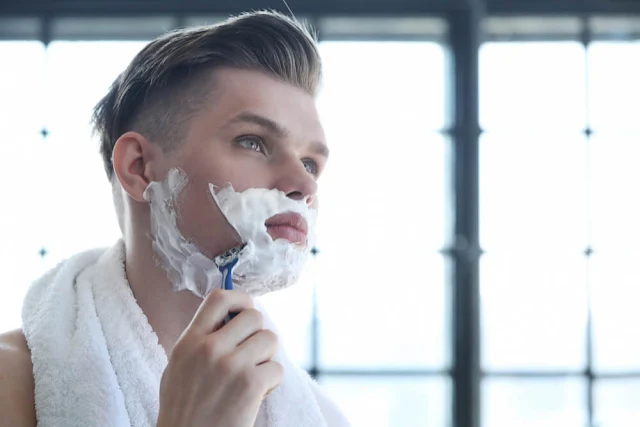 Man shaving his beard