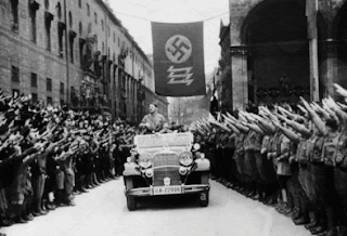 Hitler being driven past the Feldherrnhalle  during his triumphal tour through Munich after returning from the occupation of Memel on March 26, 1939