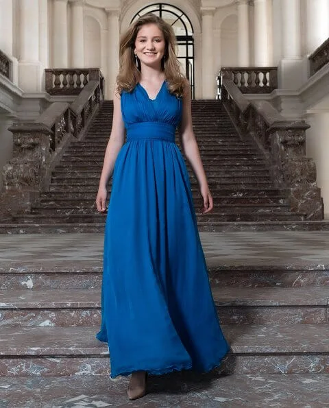 Crown Princess Elisabeth wearing bridesmaid blue v-neck chiffon maxi dress, Sandro  red dress, Zara sweater, Ole Lynggaard earrings