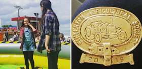 My girls on a trampoline and a gold medal from an agricultural show with a tractor on.