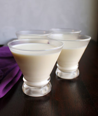 Vanilla yogurt panna cotta feels like a sophisticated dessert, but it is really a simple make ahead recipe. Top it with fruit for an extra special treat. yogurt panna cotta in stemless martini glasses