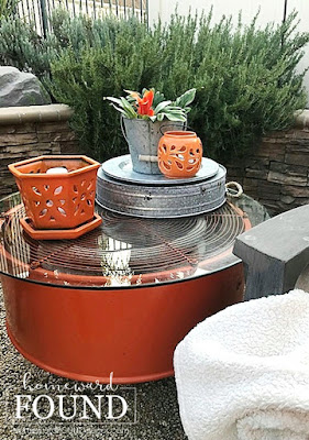 fall, outdoor decor, outdoor fall decor, salvaged, upcycled, repurposed, junk makeover, industrial style, trash to treasure, orange accent color, firepit area decor, backyard decor,  use what you have decorating, farmhouse style, DIY, DIY decorating, DIY project, salvaged metal industrial fan becomes outdoor table