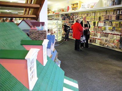 Two customers chatting in the new Fairy Meadow Miniatures shop.