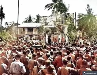 The chaplain delivers the invocation at the Liberation Festival, Santo Tomas, 1945. Image source: United States National Archives.